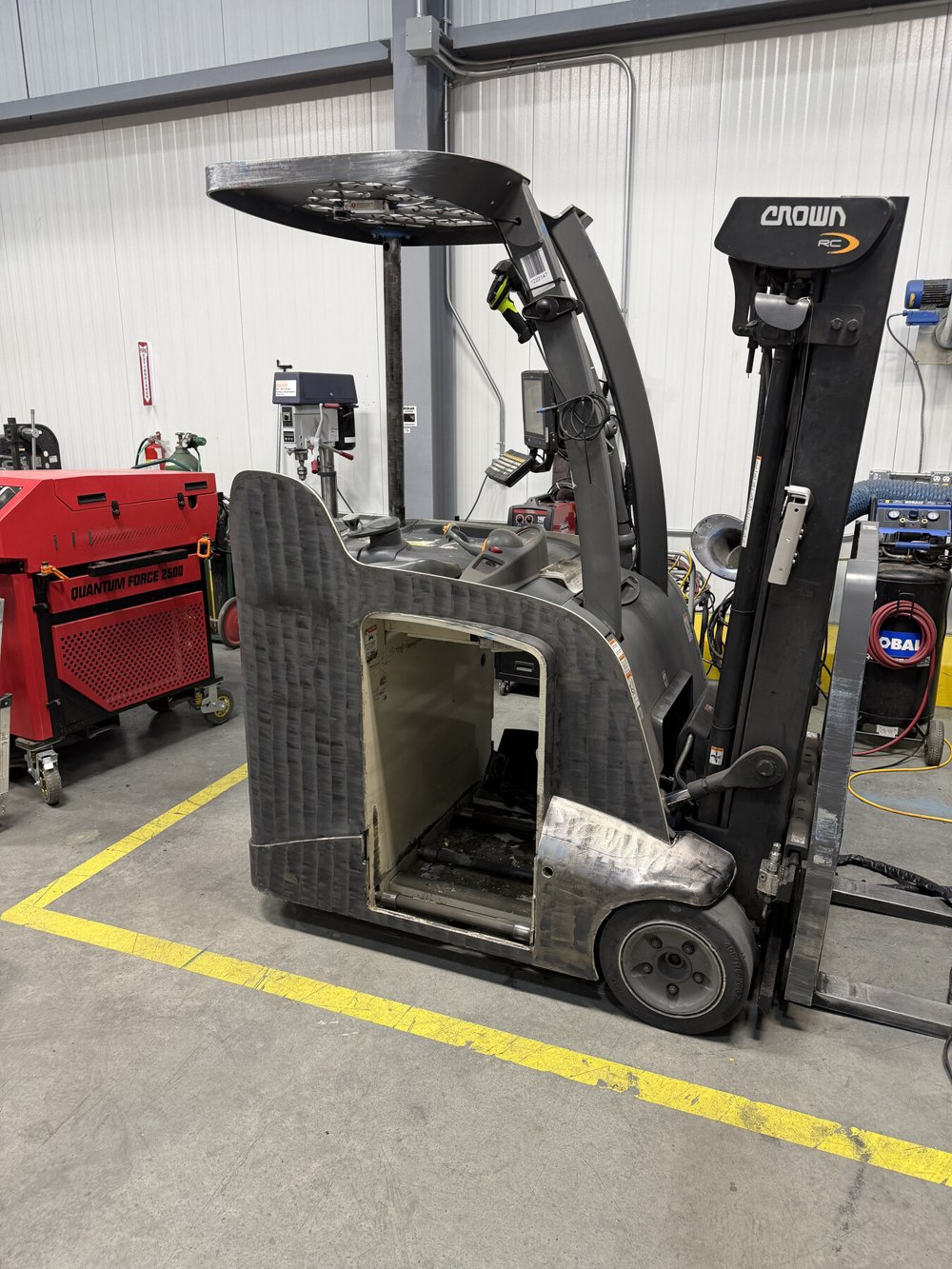 Forklift after laser cleaning, with the original metal exposed on the body panel